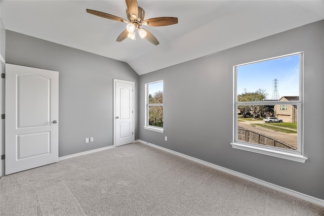 537 Green Cedar Dr, League City, TX 77573 - unfurnished bedroom with carpet flooring, vaulted ceiling, and a ceiling fan