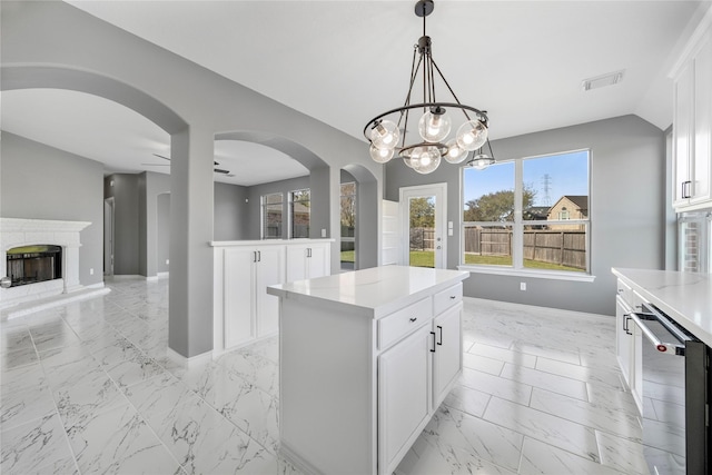 537 Green Cedar Dr, League City, TX 77573 - kitchen featuring light marble finish floors, dishwasher, white cabinetry, hanging light fixtures, and a chandelier