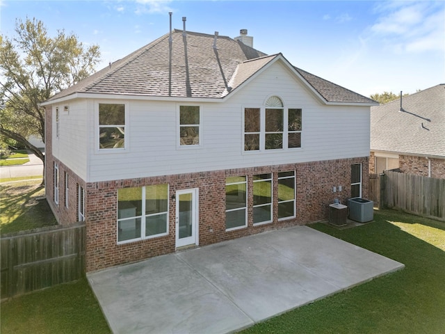 537 Green Cedar Dr, League City, TX 77573 - back of property with brick siding, a fenced backyard, a chimney, and a patio area