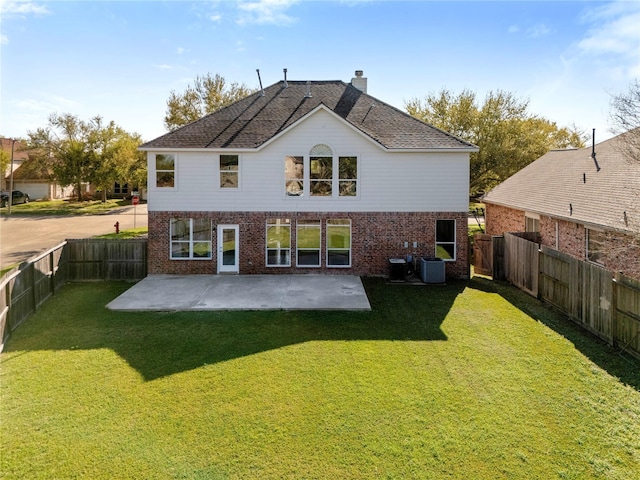 537 Green Cedar Dr, League City, TX 77573 - rear view of house featuring brick siding, a patio, a fenced backyard, and a chimney