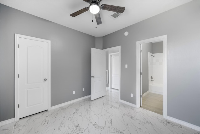 537 Green Cedar Dr, League City, TX 77573 - unfurnished bedroom featuring light marble finish floors, connected bathroom, and ceiling fan