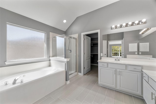 537 Green Cedar Dr, League City, TX 77573 - full bath with a stall shower, vanity, a garden tub, lofted ceiling, and a spacious closet
