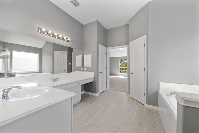 537 Green Cedar Dr, League City, TX 77573 - full bathroom featuring vanity, a bath, and wood finish floors