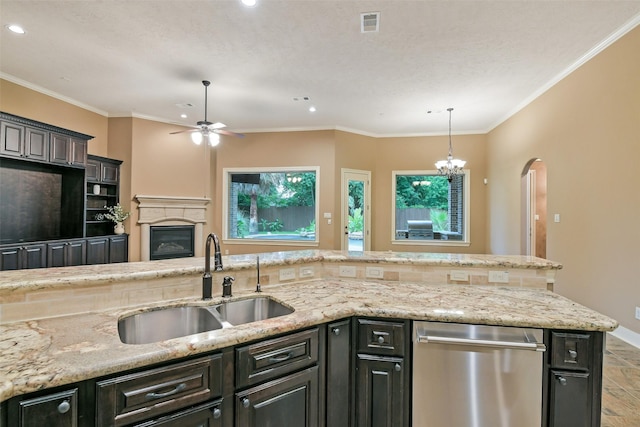 13622 Kluge Corner Ln, Cypress, TX 77429 - kitchen with a ceiling fan, dishwasher, recessed lighting, a glass covered fireplace, and light stone countertops