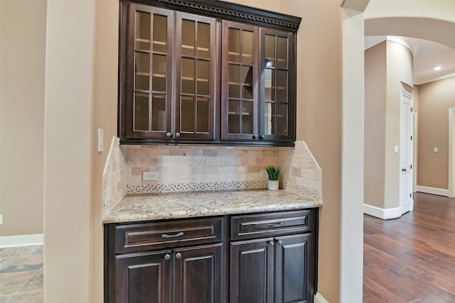 13622 Kluge Corner Ln, Cypress, TX 77429 - bar with arched walkways, decorative backsplash, and dark wood-type flooring