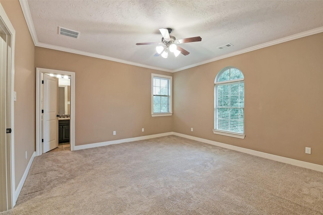 13622 Kluge Corner Ln, Cypress, TX 77429 - unfurnished bedroom featuring a textured ceiling, crown molding, light colored carpet, ensuite bathroom, and a ceiling fan
