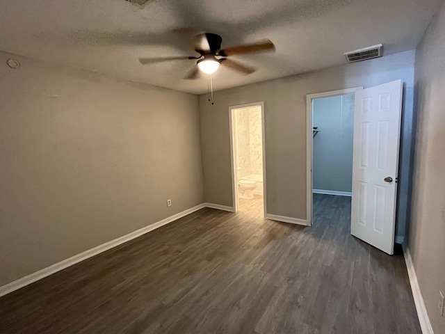 4831 Sycamore Ave Unit 16, Pasadena, TX 77503 - spare room with a ceiling fan, dark wood-style flooring, and a textured ceiling