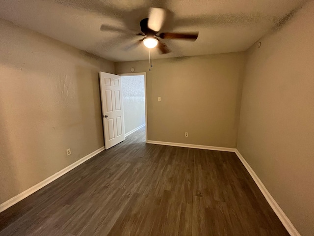 4831 Sycamore Ave Unit 16, Pasadena, TX 77503 - spare room with a textured ceiling, ceiling fan, and dark wood finished floors