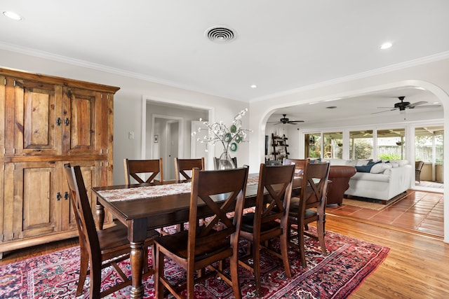 1219 Del Norte St, Houston, TX 77018 - dining room featuring arched walkways, crown molding, a ceiling fan, recessed lighting, and light wood-style floors