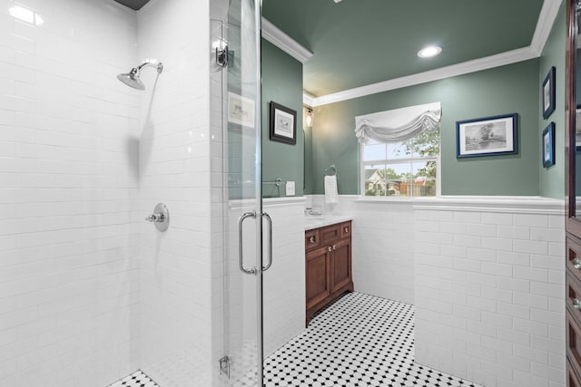1219 Del Norte St, Houston, TX 77018 - bathroom featuring vanity, a shower stall, tile walls, ornamental molding, and a wainscoted wall