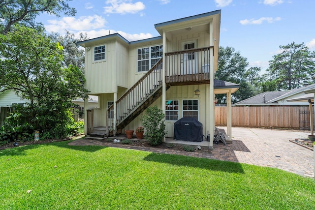 1219 Del Norte St, Houston, TX 77018 - back of property featuring a patio area, stairway, and board and batten siding