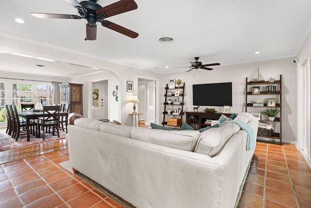 1219 Del Norte St, Houston, TX 77018 - living room with a ceiling fan, ornamental molding, tile patterned floors, arched walkways, and recessed lighting