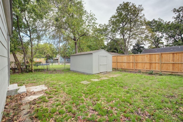 4220 Delhi St, Houston, TX 77022 - fenced backyard with a trampoline and a storage unit