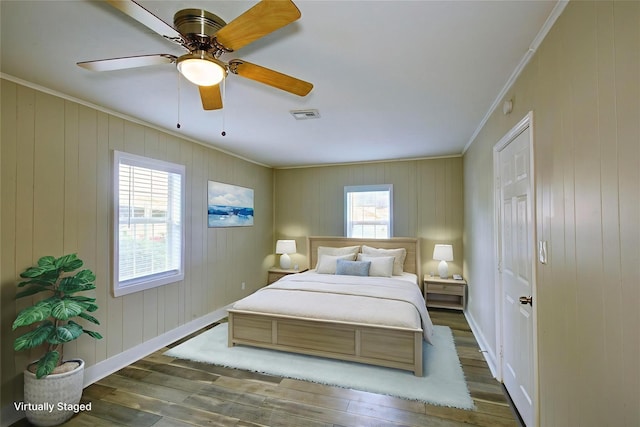 4220 Delhi St, Houston, TX 77022 - bedroom featuring ornamental molding, wood finished floors, and ceiling fan