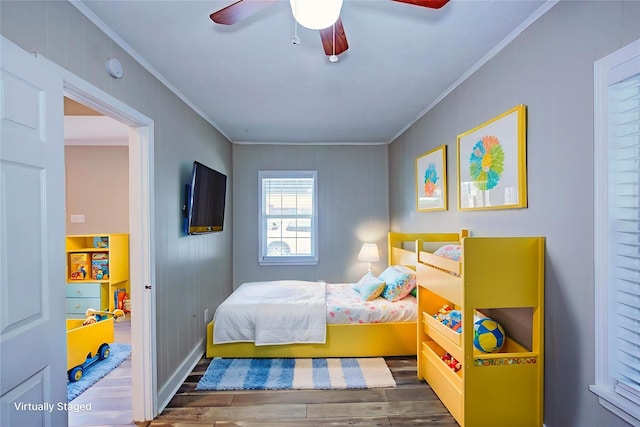 4220 Delhi St, Houston, TX 77022 - bedroom with ornamental molding, wood finished floors, and ceiling fan
