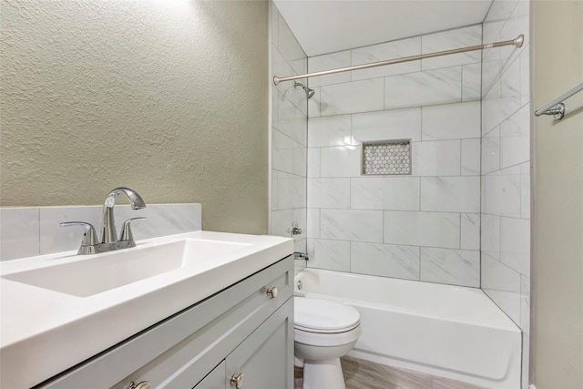 5955 Bellfort St, Houston, TX 77033 - bathroom with a textured wall, vanity, and  shower combination