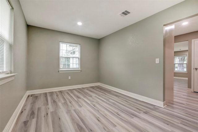 5955 Bellfort St, Houston, TX 77033 - empty room featuring light wood-type flooring and recessed lighting