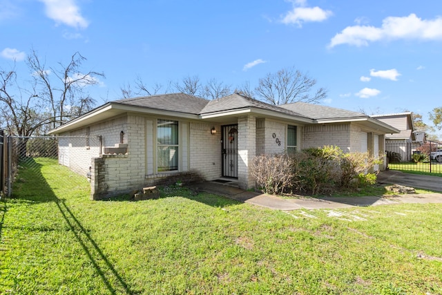 2003 Deerhurst Ln, Houston, TX 77088 - view of front facade featuring brick siding, a garage, driveway, and a shingled roof