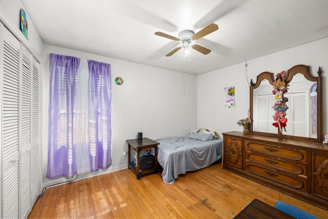 12337 Kayla Ln, Houston, TX 77015 - bedroom with light wood-style floors, a ceiling fan, and a closet