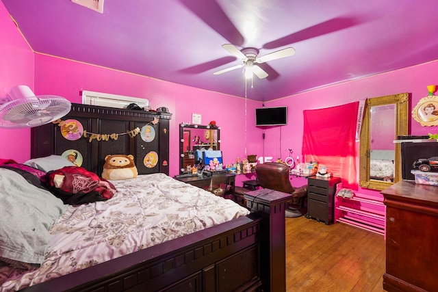 12337 Kayla Ln, Houston, TX 77015 - bedroom with hardwood / wood-style flooring and a ceiling fan