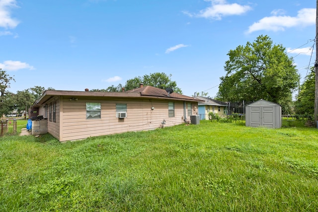 12337 Kayla Ln, Houston, TX 77015 - rear view of house with a storage shed and cooling unit