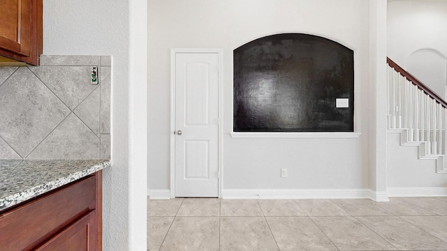2135 Llerena Ln, League City, TX 77573 - unfurnished dining area featuring stairway and light tile patterned flooring