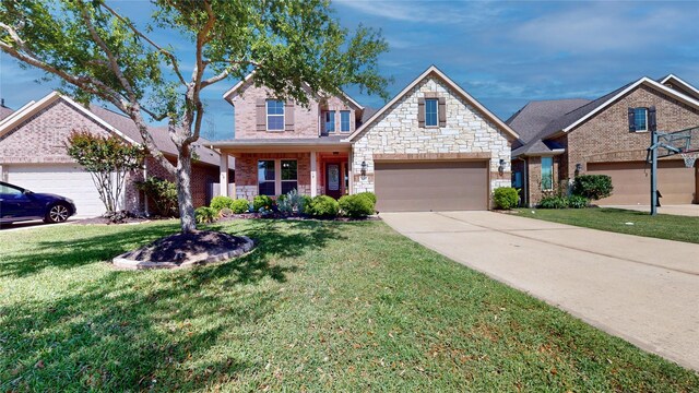 2135 Llerena Ln, League City, TX 77573 - view of front facade featuring a front lawn, brick siding, driveway, and stone siding