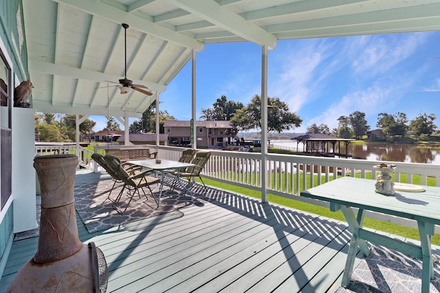 1575 Yaupon Cove Dr, Onalaska, TX 77360 - deck featuring a ceiling fan, outdoor dining area, and a water view