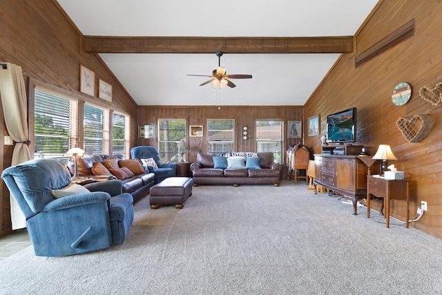 1575 Yaupon Cove Dr, Onalaska, TX 77360 - carpeted living room with wood walls and ceiling fan
