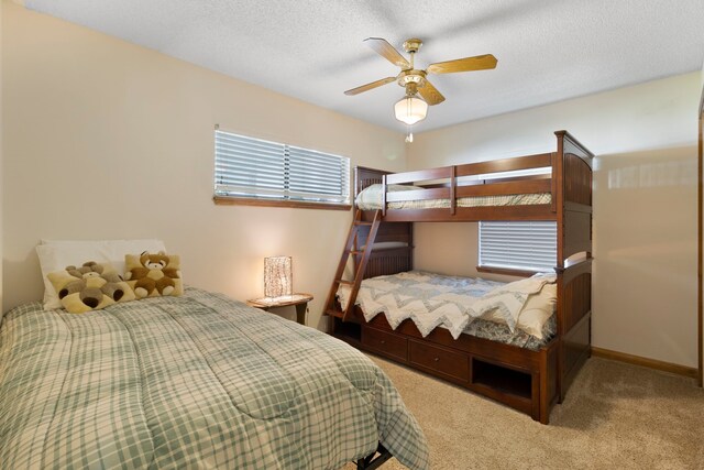1575 Yaupon Cove Dr, Onalaska, TX 77360 - carpeted bedroom featuring ceiling fan