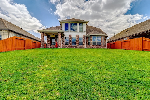 24030 Cannon Anello Ct, Katy, TX 77493 - back of house with a fenced backyard, a ceiling fan, and a shingled roof