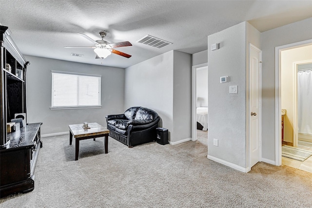24030 Cannon Anello Ct, Katy, TX 77493 - living area featuring ceiling fan, carpet flooring, and a textured ceiling
