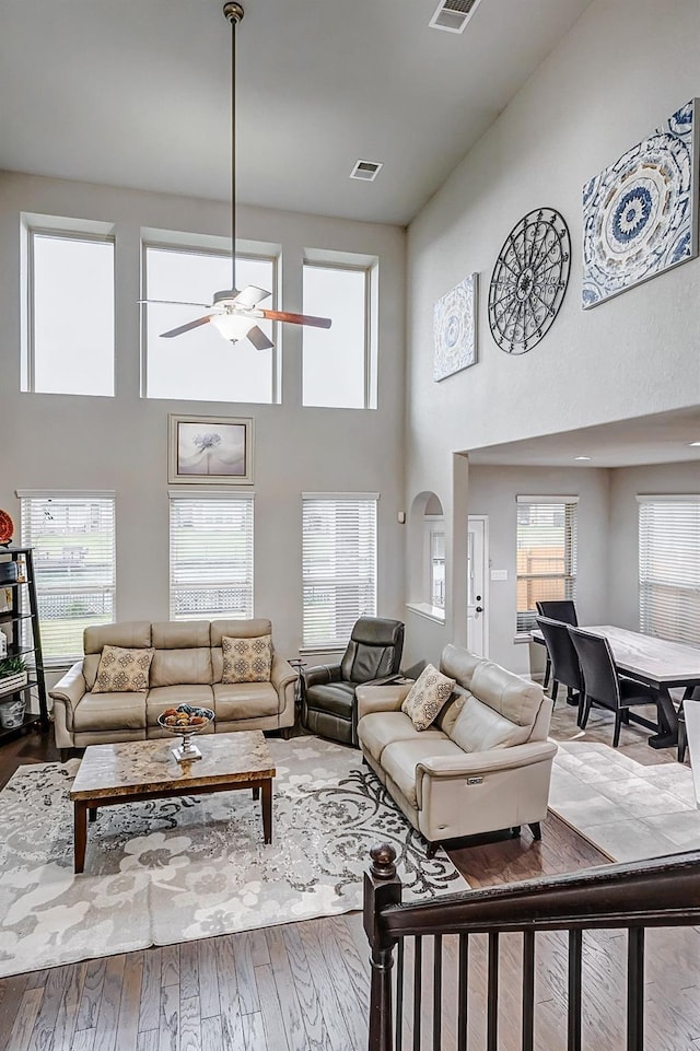 24030 Cannon Anello Ct, Katy, TX 77493 - living area with a ceiling fan, a high ceiling, and wood finished floors