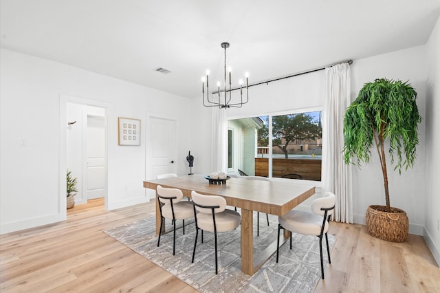4318 Cheena Dr, Houston, TX 77096 - dining space with a chandelier and light wood finished floors