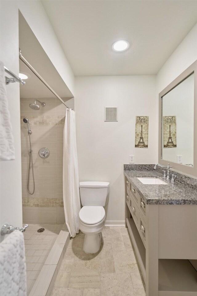 1601 S Shepherd Dr Unit 222, Houston, TX 77019 - full bathroom featuring vanity, a tile shower, and recessed lighting