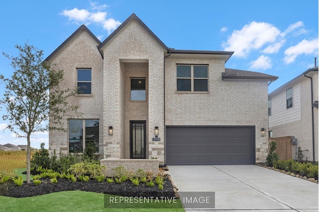 3232 Stingray Cove Dr, Katy, TX 77493 - view of front of house with an attached garage, concrete driveway, and brick siding