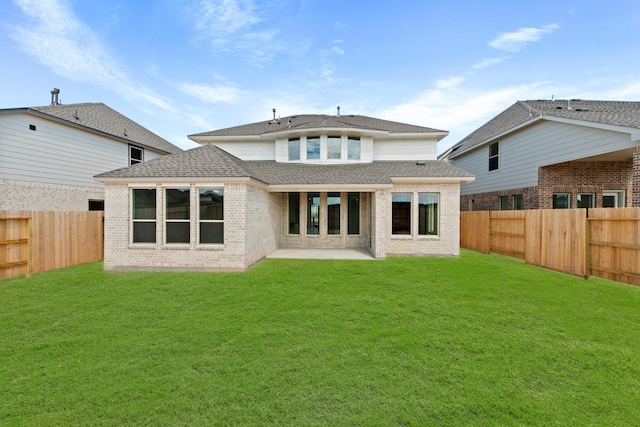 3232 Stingray Cove Dr, Katy, TX 77493 - back of property with a shingled roof, a fenced backyard, a patio, and brick siding