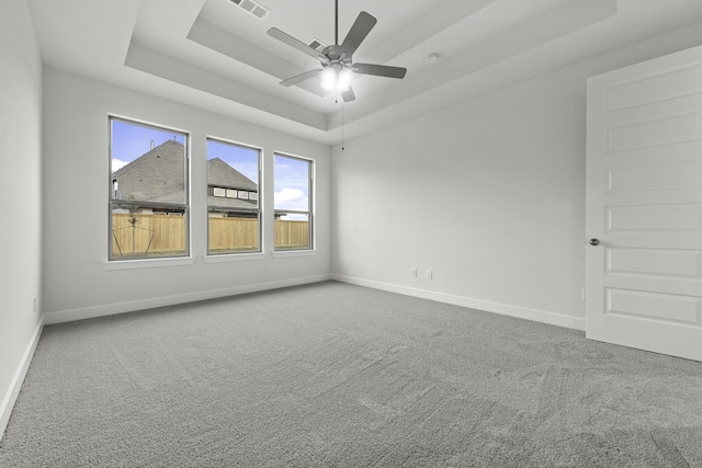 3232 Stingray Cove Dr, Katy, TX 77493 - empty room with a tray ceiling, carpet flooring, and ceiling fan