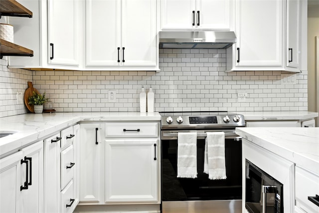 1610 Antoine Dr, Houston, TX 77055 - kitchen featuring stainless steel electric range, under cabinet range hood, open shelves, white cabinetry, and decorative backsplash
