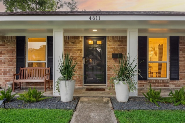 4611 Dunsmere St, Houston, TX 77018 - view of exterior entry with covered porch and brick siding
