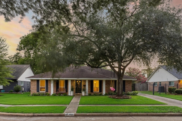 4611 Dunsmere St, Houston, TX 77018 - ranch-style house featuring brick siding, driveway, covered porch, and a gate