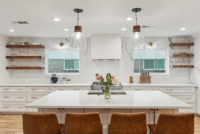 4611 Dunsmere St, Houston, TX 77018 - kitchen with open shelves, a breakfast bar area, light countertops, and recessed lighting