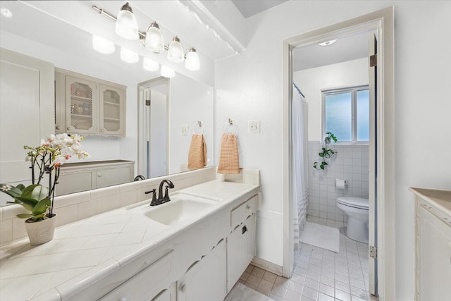 4611 Dunsmere St, Houston, TX 77018 - full bath with vanity, tile walls, curtained shower, and tile patterned floors