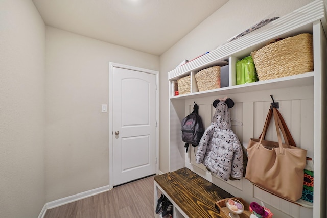 26410 Yaupon Crk, Magnolia, TX 77355 - mudroom with wood finished floors and baseboards