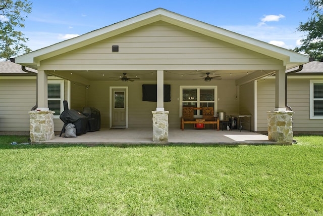 26410 Yaupon Crk, Magnolia, TX 77355 - rear view of property featuring a ceiling fan, a yard, and a patio