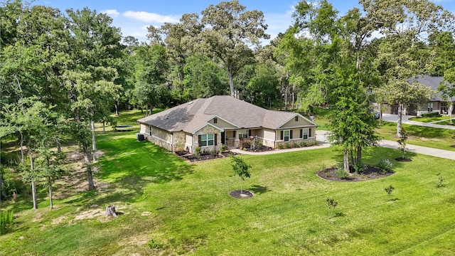 26410 Yaupon Crk, Magnolia, TX 77355 - view of front of house with a front lawn
