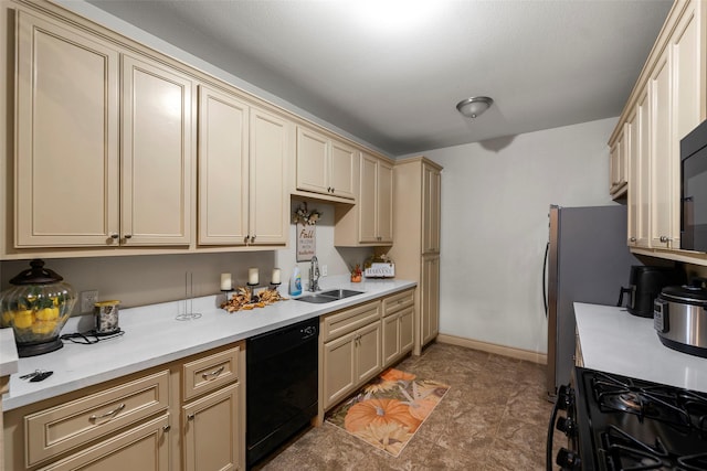 1541 3rd St, Hempstead, TX 77445 - kitchen featuring dishwasher, gas range, cream cabinets, and light countertops