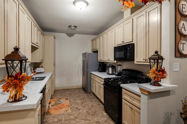 1541 3rd St, Hempstead, TX 77445 - kitchen featuring black appliances, cream cabinetry, light countertops, and stone finish floors