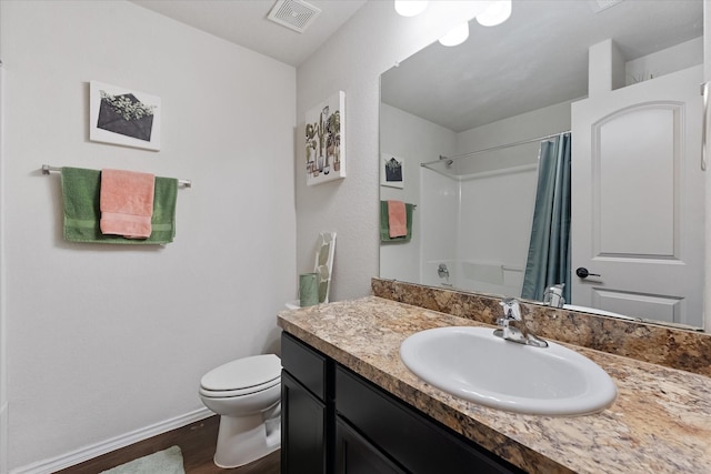 1055 Rancho Grande Dr, Channelview, TX 77530 - full bath featuring vanity, wood finished floors, and a shower with shower curtain