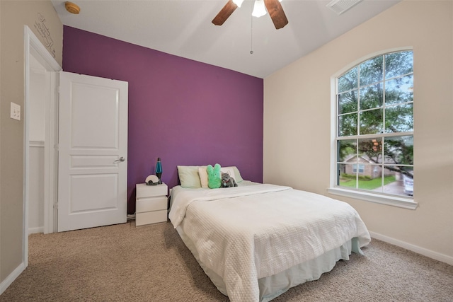 2513 Garnetfield Ln, Friendswood, TX 77546 - carpeted bedroom featuring baseboards and a ceiling fan